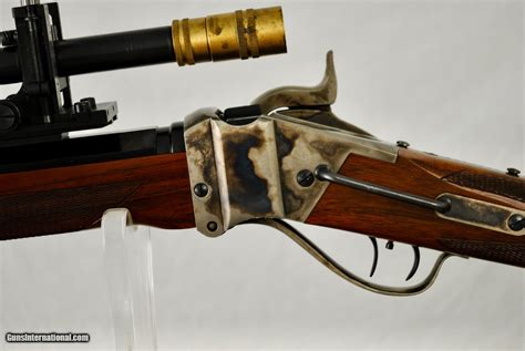 Finish is worn and the markings have been defaced but the scope is in otherwise good, usable condition. . Sharps rifle with malcolm scope